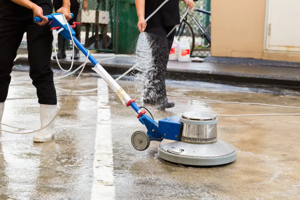 Exterior concrete floor cleaning with polishing machine and chemical